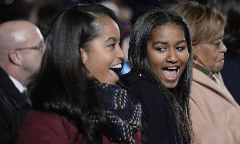 Malia and Sasha Obama at the National Christmas Tree Lighting Ceremony on the Ellipse south of the White House in Washington, D.C., on Dec. 3, 2015Olivier Douliery/Pool/Getty Images